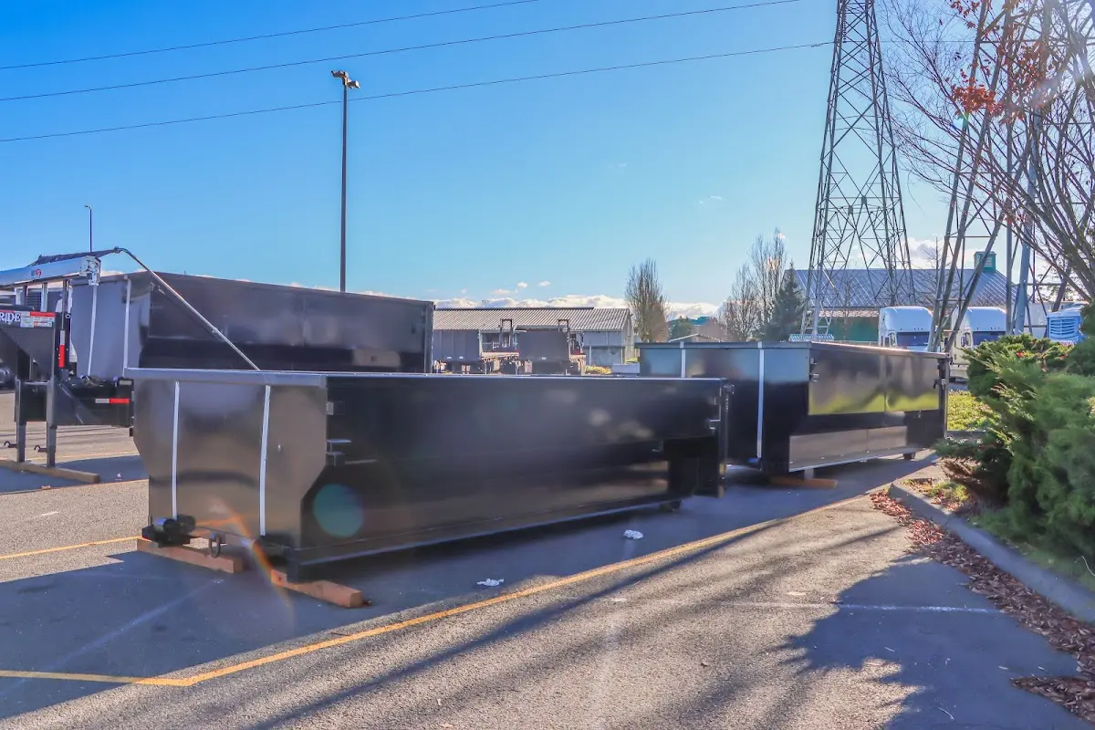 Roll-off dumpster ready for waste disposal at job site for Demolition Dumpster Rental in Oak Ridge